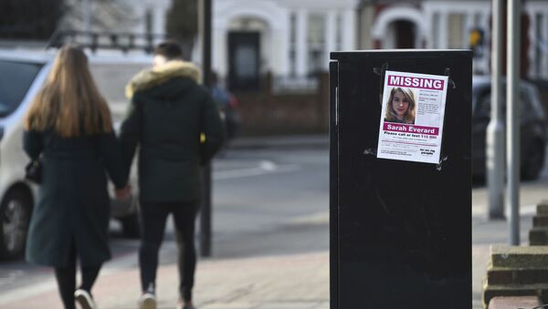 A couple walk past a poster in south London appealing for help in finding missing Sarah Everard - Sputnik International