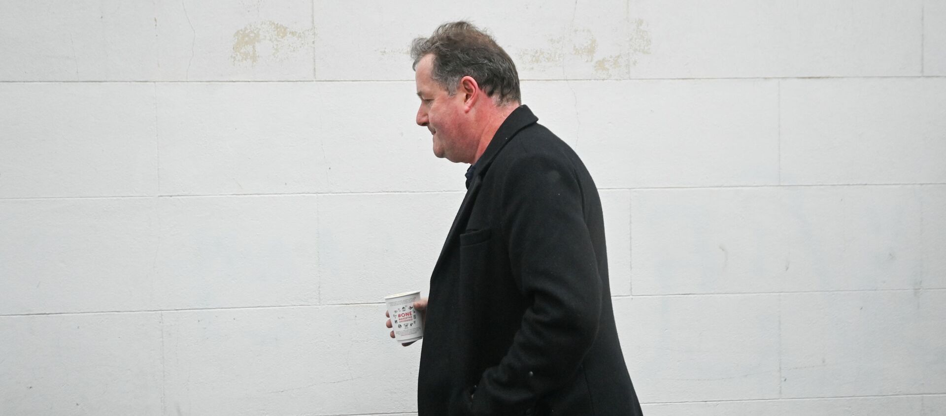 Journalist and television presenter Piers Morgan walks back to his house, after he left his high-profile breakfast slot with the broadcaster ITV, following his long-running criticism of Prince Harry's wife Meghan, in London, Britain, March 10, 2021. REUTERS/Toby Melville - Sputnik International, 1920, 10.03.2021