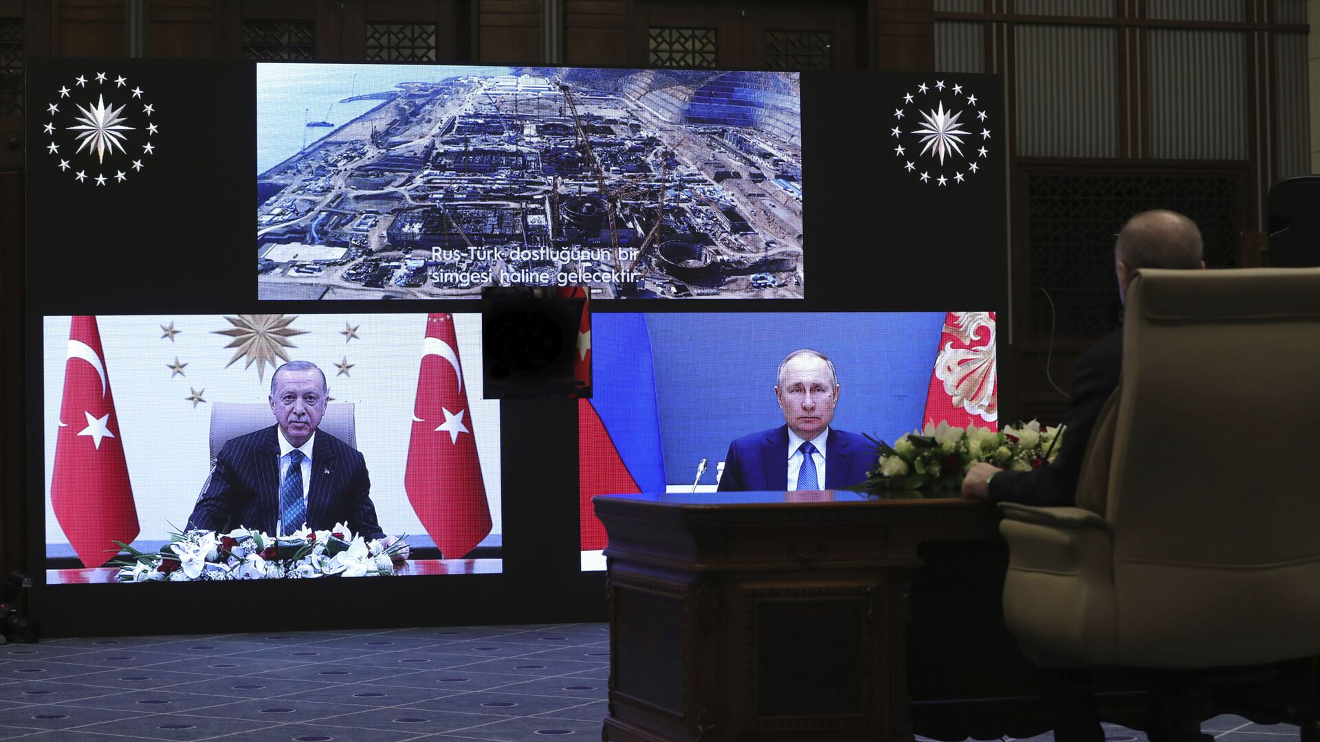 Turkey's Recep Tayyip Erdogan sitting extreme right, and on screen bottom left, with Russia's President Vladimir Putin, bottom right, speak during a ceremony as they have remotely inaugurated the construction of a third nuclear reactor of Akkuyu power plant in Mersin province on the Mediterranean coast, in Ankara, Turkey, Wednesday, March 10, 2021. Erdogan called the plant a symbol of Turkish-Russian cooperation. - Sputnik International, 1920, 03.03.2022