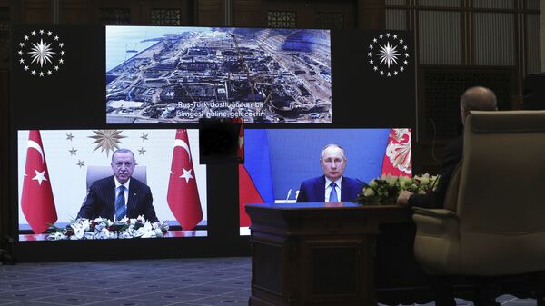 Turkey's Recep Tayyip Erdogan sitting extreme right, and on screen bottom left, with Russia's President Vladimir Putin, bottom right, speak during a ceremony as they have remotely inaugurated the construction of a third nuclear reactor of Akkuyu power plant in Mersin province on the Mediterranean coast, in Ankara, Turkey, Wednesday, March 10, 2021. Erdogan called the plant a symbol of Turkish-Russian cooperation. - Sputnik International