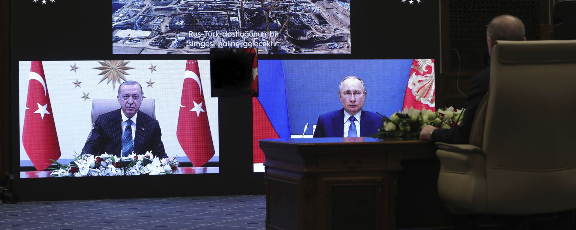 Turkey's Recep Tayyip Erdogan sitting extreme right, and on screen bottom left, with Russia's President Vladimir Putin, bottom right, speak during a ceremony as they have remotely inaugurated the construction of a third nuclear reactor of Akkuyu power plant in Mersin province on the Mediterranean coast, in Ankara, Turkey, Wednesday, March 10, 2021. Erdogan called the plant a symbol of Turkish-Russian cooperation. - Sputnik International, 1920, 10.03.2021