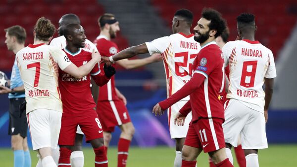 Soccer Football - Champions League - Round of 16 Second Leg - Liverpool v RB Leipzig - Puskas Arena, Budapest, Hungary - March 10, 2021 Liverpool's Mohamed Salah celebrates with teammates after the match - Sputnik International