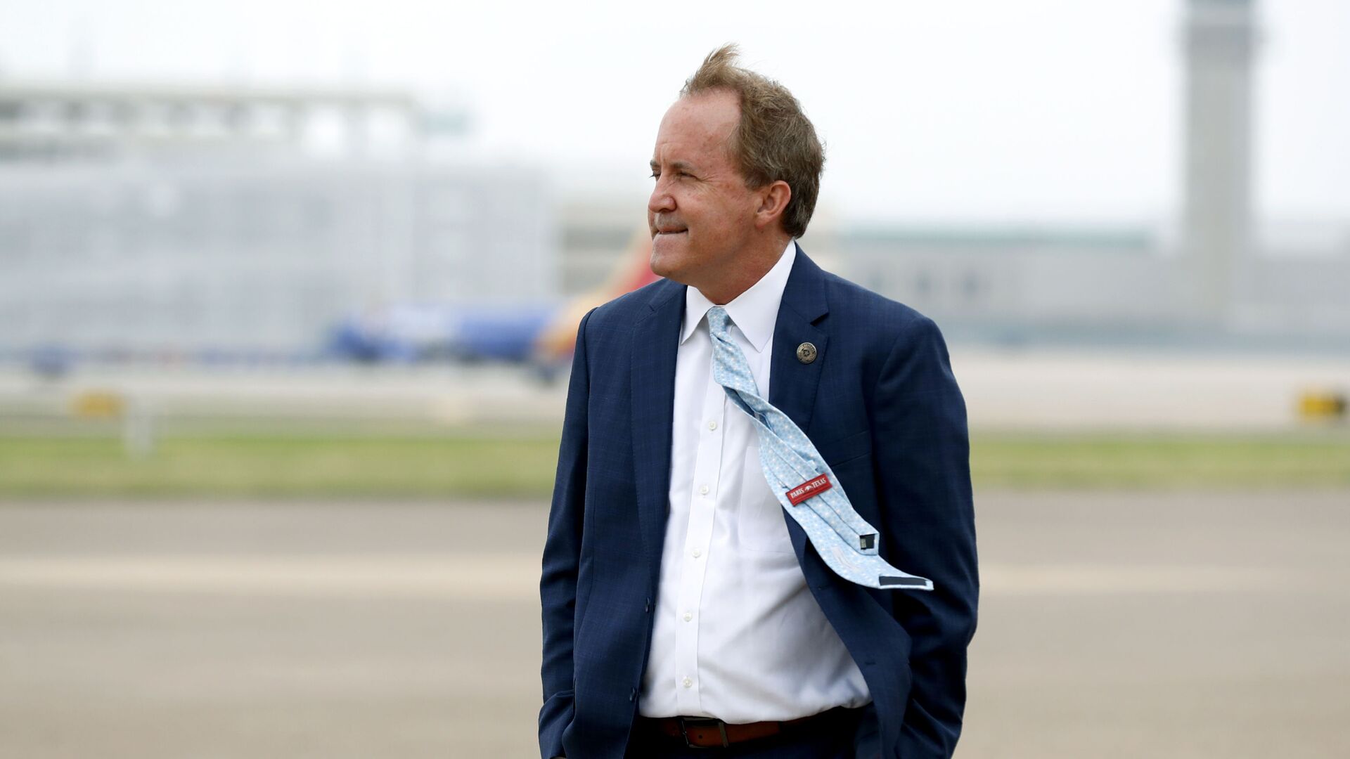 In this June 28, 2020 file photo, Texas' Attorney General Ken Paxton waits on the flight line for the arrival of Vice President Mike Pence at Love Field in Dallas. The mass exodus of Paxton's top staff over accusations of bribery against their former boss has left the Republicans seeking $43 million in public funds to replace some of them with outside lawyers to lead a high-profile antitrust lawsuit against Google. - Sputnik International, 1920, 17.09.2023