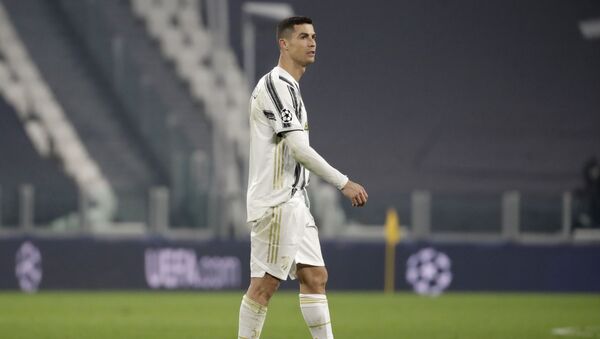 Juventus' Cristiano Ronaldo walks on the pitch at the end of the Champions League, round of 16, second leg, soccer match between Juventus and Porto in Turin, Italy, Tuesday, March 9, 2021. Juventus won 3-2 but Porto advances on a 4-4 aggregate result.  - Sputnik International