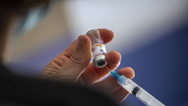 A healthcare worker prepares a dose of the Sinovac COVID-19 vaccine at the Carmela Carvajal public school in Santiago, Chile, Wednesday, March 10, 2021 - Sputnik International