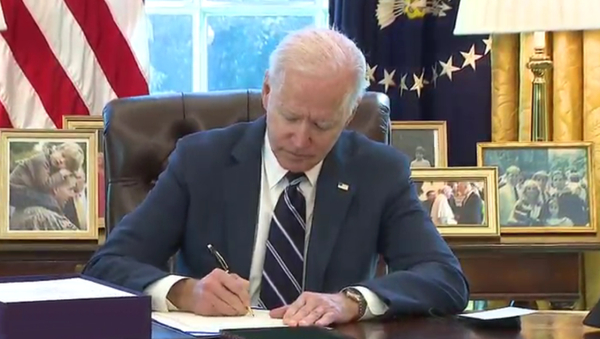US President Joe Biden signing the American Rescue Plan Act into law in the Oval Office on March 11, 2021. - Sputnik International