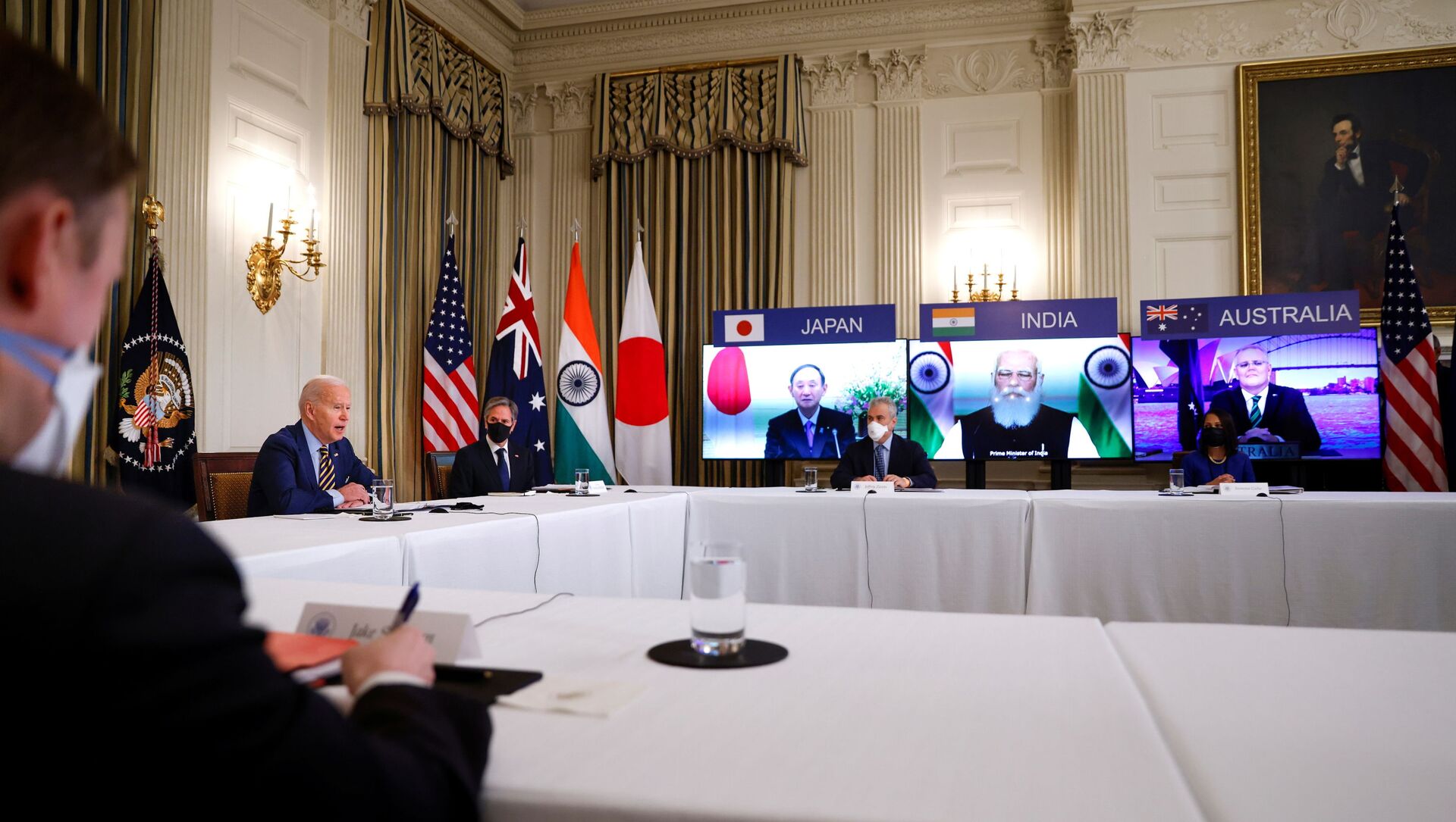 U.S. President Joe Biden and Vice President Kamala Harris, not pictured, participate beside staff and cabinet members in a virtual meeting with Asia-Pacific nation leaders at the White House in Washington, U.S., March 12, 2021. - Sputnik International, 1920, 12.03.2021