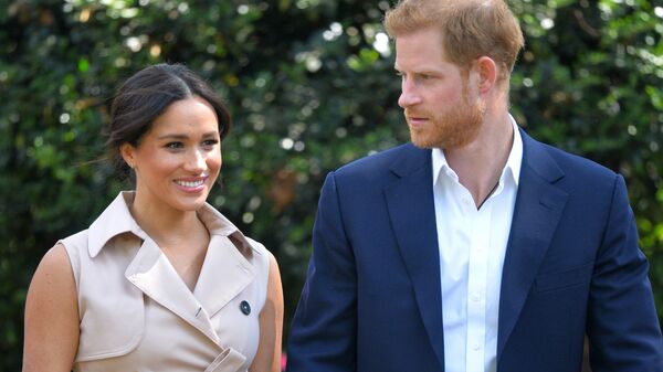 In this Oct. 2, 2019, file photo, Britain's Harry and Meghan, Duchess of Sussex arrive at the Creative Industries and Business Reception at the British High Commissioner's residence in Johannesburg, where they will meet with representatives of the British and South African business communities, including local youth entrepreneurs - Sputnik International