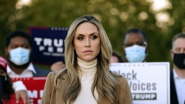 Lara Trump, daughter-in-law of President Donald Trump listens to Rudy Giuliani, a lawyer for President Trump, speak during a news conference on legal challenges to vote counting in Pennsylvania, Wednesday, Nov. 4, 2020, in Philadelphia - Sputnik International