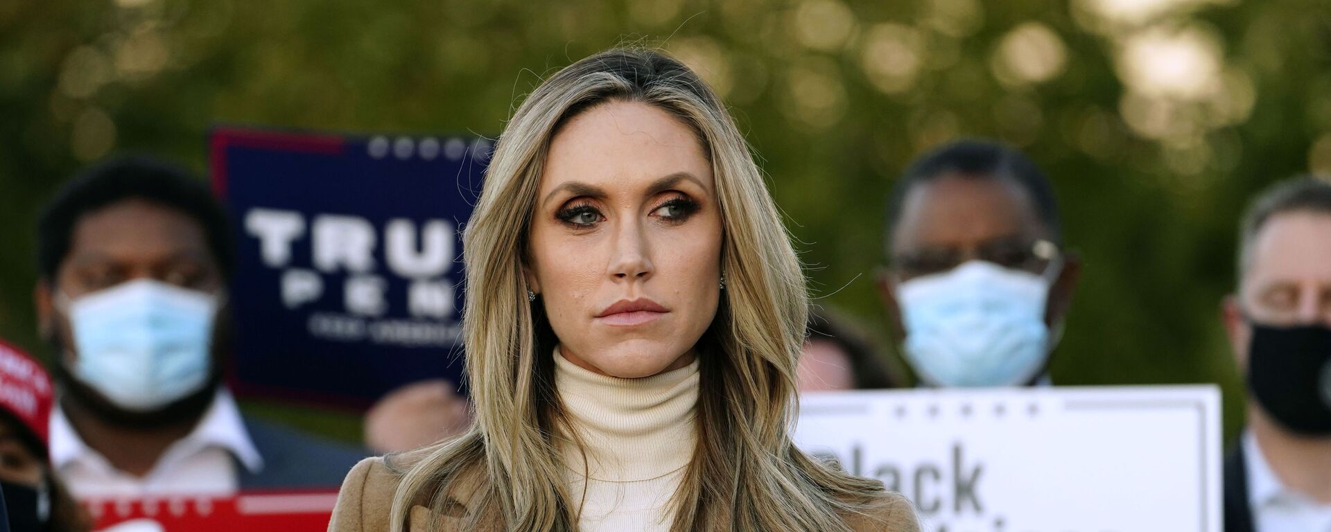 Lara Trump, daughter-in-law of President Donald Trump listens to Rudy Giuliani, a lawyer for President Trump, speak during a news conference on legal challenges to vote counting in Pennsylvania, Wednesday, Nov. 4, 2020, in Philadelphia - Sputnik International, 1920, 10.04.2021