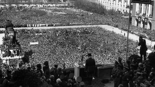A general view of German Chancellor Adolf Hitler, centre bottom back to camera, addressing the huge crowd in the Heldenplatz in Vienna, Austria, on March 15, 1938, illustrating the depth of the people who stood for hours to welcome Hitler officially to Vienna and Austria.  - Sputnik International