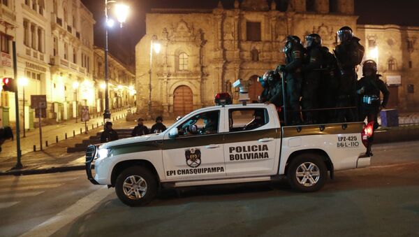 Police patrol in La Paz, Bolivia, Monday, Nov. 11, 2019. Former Bolivian President Evo Morales said Monday he was headed for Mexico after being granted asylum there, as his supporters and foes clashed on the streets of the capital following his resignation.  - Sputnik International