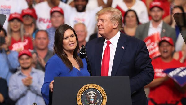  JUNE 18: U.S. President Donald Trump stands with Sarah Huckabee Sanders, who announced that she is stepping down as the White House press secretary, during his rally where he announced his candidacy for a second presidential term at the Amway Center on June 18, 2019 in Orlando, Florida - Sputnik International