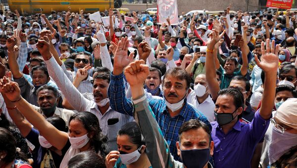 Bank employees shout slogans during a protest, as part of a two-day long nationwide strike, outside a bank in Ahmedabad, India, March 15, 2021 - Sputnik International