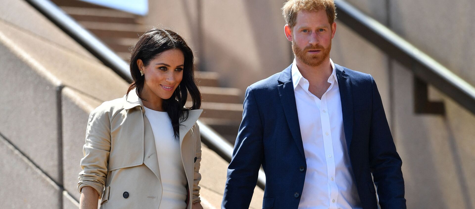 (FILES) In this file photo taken on October 16, 2018 Britain's Prince Harry and his wife Meghan walk down the stairs of Sydney’s iconic Opera House to meet people in Sydney - Sputnik International, 1920, 15.03.2021