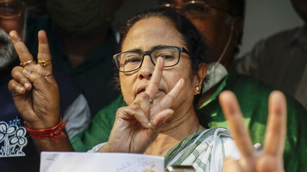 Chief Minister of West Bengal state and Trinamool Congress party leader Mamata Banerjee displays the victory symbol during the declaration of the names of the party's candidates for the upcoming legislative assembly elections in Kolkata, India, Friday, March 5, 2021.  - Sputnik International