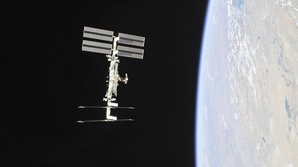 This file NASA handout photo obtained November 4, 2018 shows the International Space Station photographed by Expedition 56 crew members from a Soyuz spacecraft after undocking.  - Sputnik International