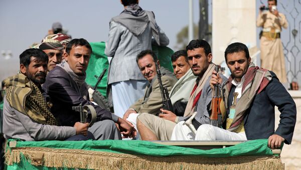 Armed Houthi followers ride on the back of a truck after participating in a funeral of Houthi fighters killed in recent fighting against government forces in Yemen's oil-rich province of Marib, in Sanaa, Yemen February 20, 2021.  - Sputnik International