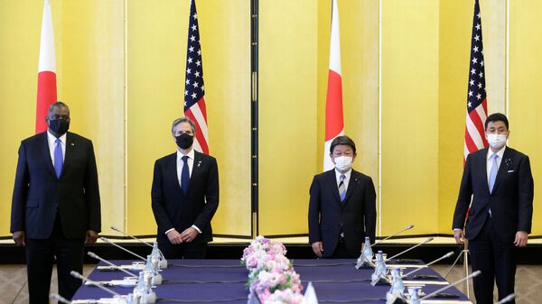 U.S. Defense Secretary Lloyd Austin and Secretary of State Antony Blinken together with Japan's Foreign Minister Toshimitsu Motegi and Defence Minister Nobuo Kishi wear protective face masks as they pose for a photo prior to the Japan - U.S. Security Consultative Committee (SCC) meeting in Tokyo, Japan, March 16, 2021 - Sputnik International
