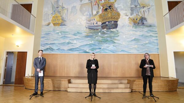 Danish Defence Minister Trine Bramsen (C) addresses a press conference with  Danish Foreign Affairs Minister Jeppe Kofoed (L) and Danske Rederier CEO Anne H. Steffensen in Copenhagen on March 16, 2021 to inform that Denmark will deploy a frigate to the Gulf of Guinea off West Africa to combat piracy, days after a Dutch vessel was attacked by pirates in the Gulf of Guinea - Sputnik International