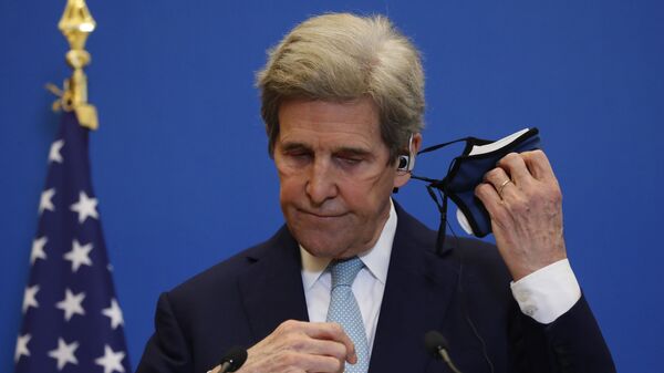 United States Special Presidential Envoy for Climate John Kerry removes his mask during a joint press conference with French Economy and Finance minister Bruno Le Maire, Wednesday, March 10, 2021 in Paris - Sputnik International
