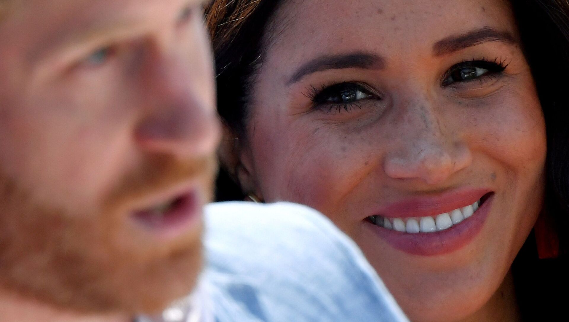 FILE PHOTO: Britain's Meghan, Duchess of Sussex, looks on as Prince Harry, Duke of Sussex, gives a speech, during a visit to the Youth Employment Services (YES) Hub in Tembisa township, near Johannesburg, South Africa, October 2, 2019 - Sputnik International, 1920, 04.07.2021