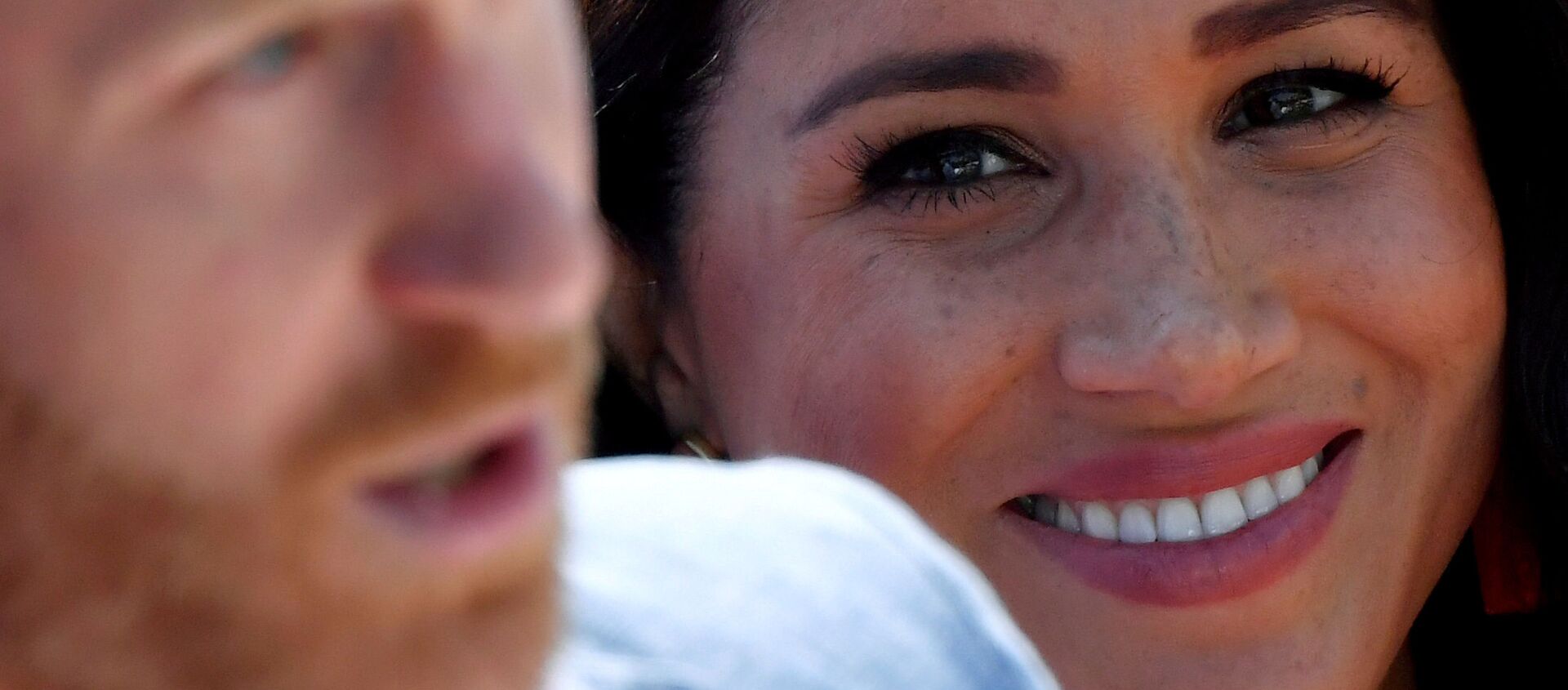 FILE PHOTO: Britain's Meghan, Duchess of Sussex, looks on as Prince Harry, Duke of Sussex, gives a speech, during a visit to the Youth Employment Services (YES) Hub in Tembisa township, near Johannesburg, South Africa, October 2, 2019 - Sputnik International, 1920, 18.03.2021