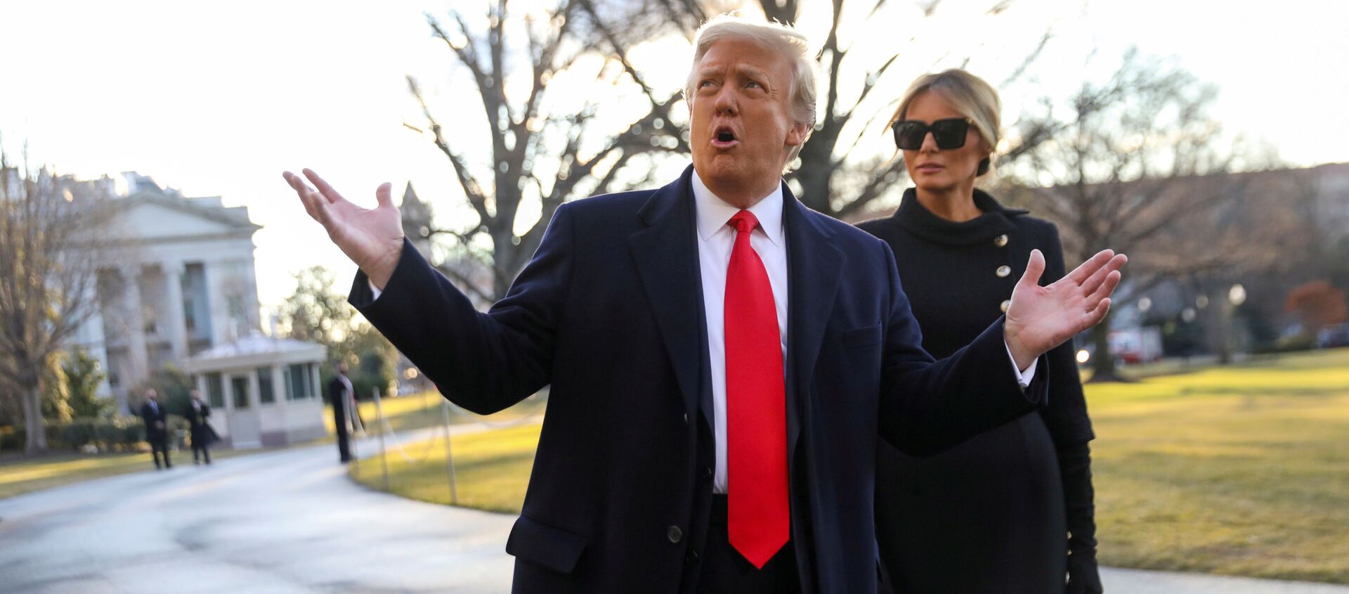 US President Donald Trump gestures as he and first lady Melania Trump depart the White House to board Marine One ahead of the inauguration of president-elect Joe Biden, in Washington, DC, 20 January 2021. - Sputnik International, 1920, 21.03.2021