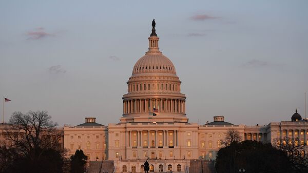 The sun sets on the U.S. Capitol building, Thursday, March 4, 2021, in Washington. - Sputnik International