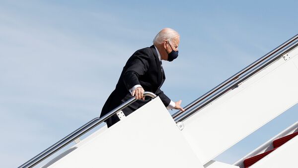 U.S. President Joe Biden grabs onto the railing after he stumbled while boarding Air Force One as he departs Washington on travel to Atlanta, Georgia to promote the $1.9 trillion coronavirus disease (COVID-19) aid package known as the American Rescue Plan, at Joint Base Andrews, Maryland, U.S., March 19, 2021. - Sputnik International