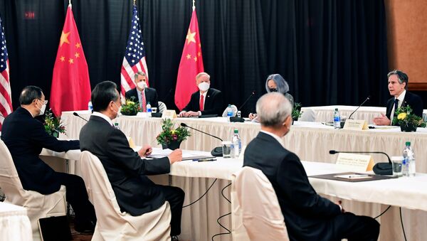 U.S. Secretary of State Antony Blinken (R) speaks while facing Yang Jiechi (L), director of the Central Foreign Affairs Commission Office, and Wang Yi (2nd L), China's State Councilor Wang and Foreign Minister, at the opening session of US-China talks at the Captain Cook Hotel in Anchorage, Alaska on March 18, 2021. - Sputnik International