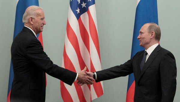 FILE PHOTO: Russian Prime Minister Vladimir Putin (R) shakes hands with U.S. Vice President Joe Biden during their meeting in Moscow March 10, 2011. - Sputnik International