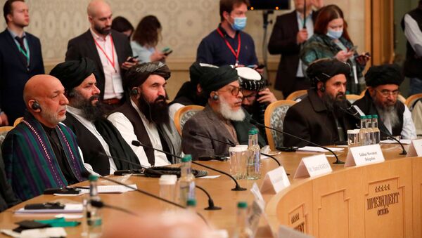 Officials, including Afghan former President Hamid Karzai and the Taliban's deputy leader and negotiator Mullah Abdul Ghani Baradar, attend the Afghan peace conference in Moscow, Russia March 18, 2021. Alexander Zemlianichenko/Pool via REUTERS - Sputnik International