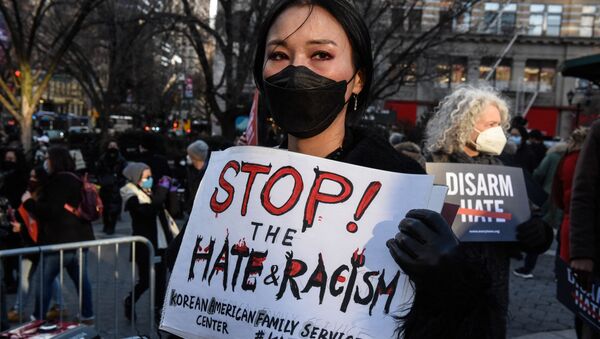 People participate in a peace vigil to honor victims of attacks on Asians on 19 March 2021 in Union Square Park in New York City.  - Sputnik International
