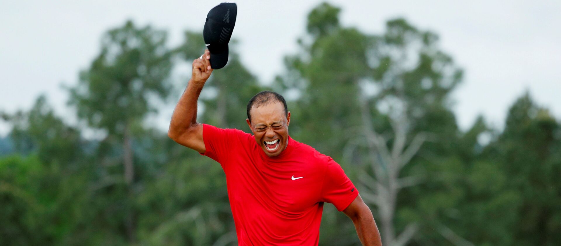 Golf - Masters - Augusta National Golf Club - Augusta, Georgia, 14 April 2019 - Tiger Woods of the U.S. celebrates on the 18th hole after winning the 2019 Masters - Sputnik International, 1920, 20.03.2021