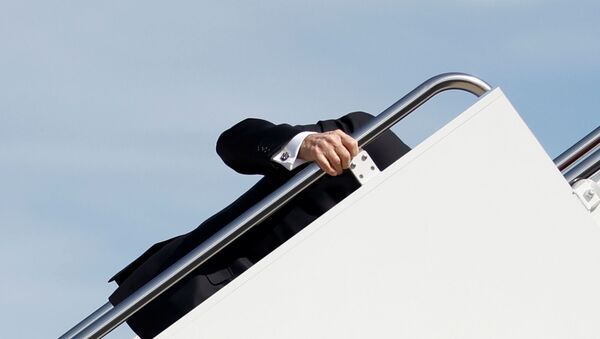 US President Joe Biden grabs onto the railing after he stumbled while boarding Air Force One as he departs Washington on travel to Atlanta, Georgia to promote the $1.9 trillion coronavirus disease (COVID-19) aid package known as the American Rescue Plan, at Joint Base Andrews, Maryland, US, March 19, 2021 - Sputnik International