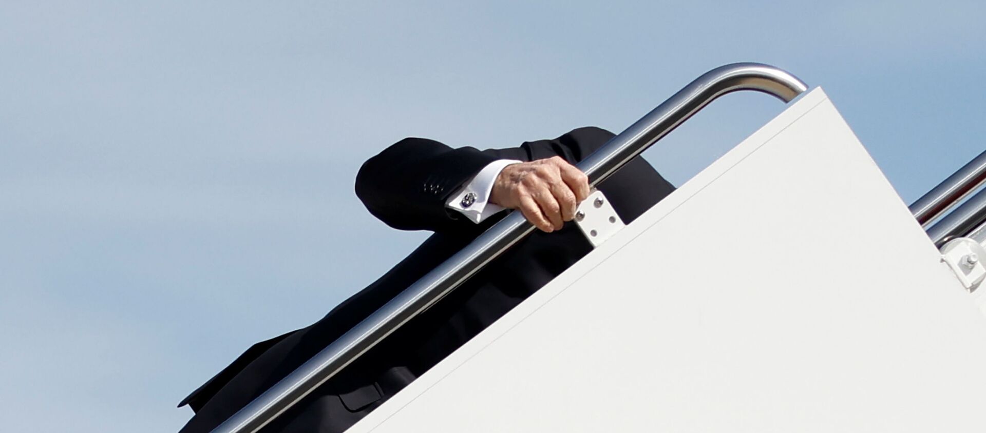 US President Joe Biden grabs onto the railing after he stumbled while boarding Air Force One as he departs Washington on travel to Atlanta, Georgia to promote the $1.9 trillion coronavirus disease (COVID-19) aid package known as the American Rescue Plan, at Joint Base Andrews, Maryland, US, March 19, 2021 - Sputnik International, 1920, 20.03.2021