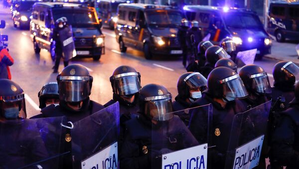 Police officers stand in formation during a protest in support of Catalan rap singer Pablo Hasel in Madrid, Spain, March 20, 2021. - Sputnik International