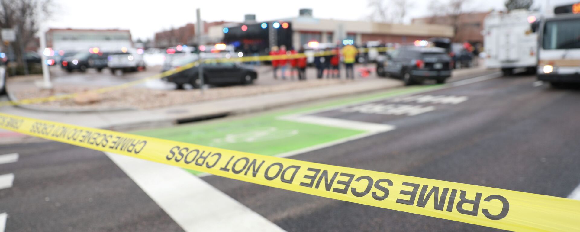 Police tape is seen at the perimeter of a shooting site at King Soopers grocery store in Boulder, Colorado, U.S. March 22, 2021.   - Sputnik International, 1920, 23.03.2021