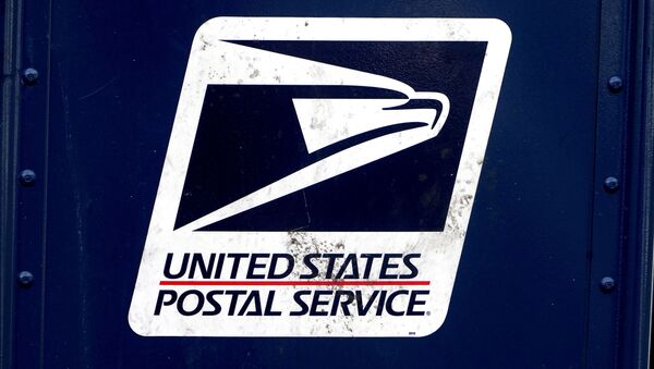 FILE PHOTO: The U.S. Postal Service (USPS) logo is pictured on a mail box in the Manhattan borough of New York City, New York, U.S., August 21, 2020. REUTERS/Carlo Allegri/File Photo - Sputnik International