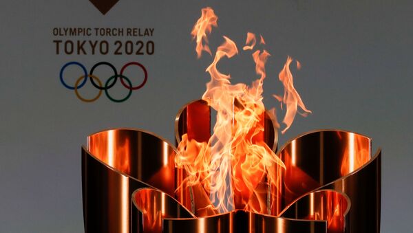 The celebration cauldron is lit on the first day of the Tokyo 2020 Olympic torch relay in Naraha, Fukushima prefecture, Japan March 25, 2021.  - Sputnik International