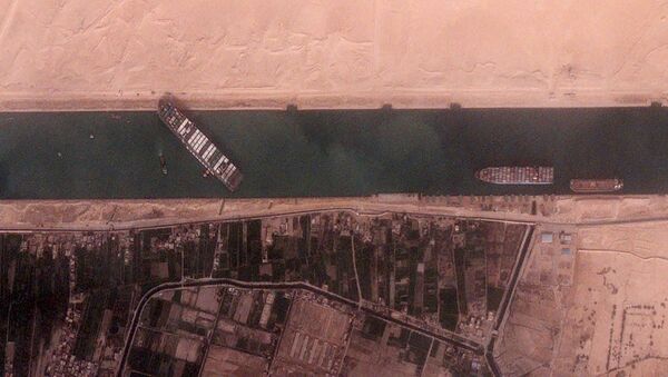 The 400-meter, 224,000-tonne Ever Given container ship, leased by Taiwan's Evergreen Marine Corp, blocks Egypt's Suez Canal in a BlackSky satellite image taken at 15:30 local time, 25 March 2021 - Sputnik International