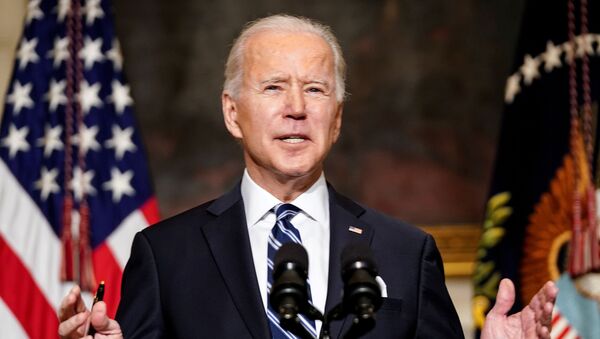 U.S. President Joe Biden delivers remarks on tackling climate change prior to signing executive actions in the State Dining Room at the White House in Washington, U.S., January 27, 2021 - Sputnik International