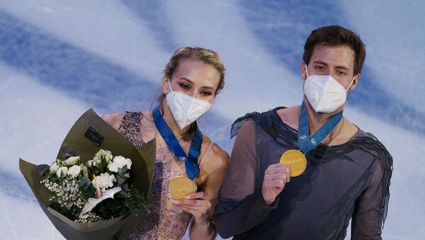 Victoria Sinitsina and Nikita Katsalapov receiving their gold medals after securing world titles in ice dance at World Figure Skating Championships in Stockholm, Sweden - Sputnik International