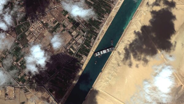 A general view of the Ever Given container ship in Suez Canal, in Suez Canal in this Maxar Technologies satellite image taken on March 27, 2021.  - Sputnik International