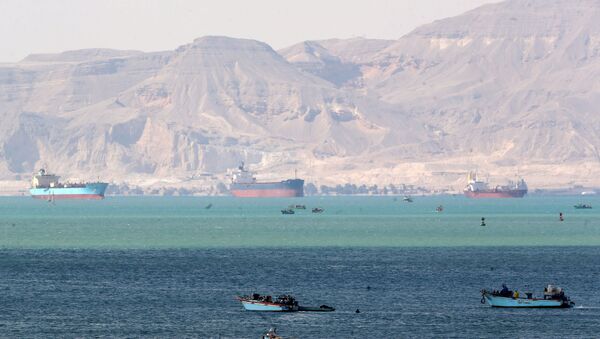 Ships and boats are seen at the entrance of Suez Canal, which was blocked by stranded container ship Ever Given that ran aground, Egypt March 28, 2021. REUTERS/Mohamed Abd El Ghany - Sputnik International