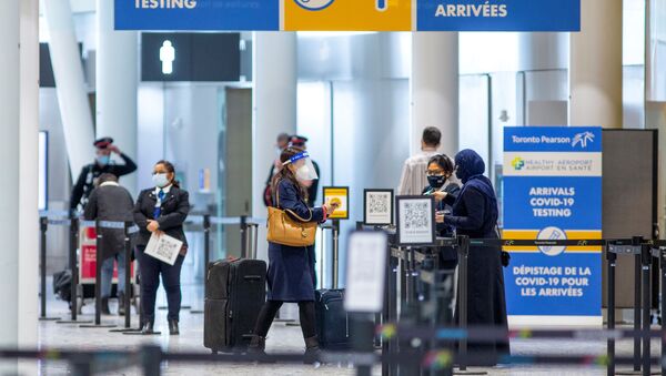 Passengers wait to be tested after they arrive at Toronto's Pearson airport after mandatory coronavirus disease (COVID-19) testing took effect for international arrivals in Mississauga, Ontario, Canada February 15, 2021 - Sputnik International