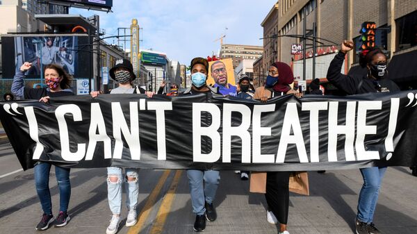 Protesters march through downtown Minneapolis during the I Can't Breathe  Silent March for Justice a day before jury selection is scheduled to begin for the trial of Derek Chauvin, the former Minneapolis policeman accused of killing George Floyd, in Minneapolis, Minnesota, 7 March 2021. - Sputnik International
