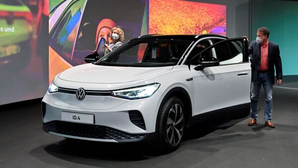Volkswagen's new electric car ID.4 SUV is pictured during its handover by the German automaker to first customers Jaqueline Heyer-Mertens and her husband Mario Heyer at the Glaeserne Manufaktur in Dresden, Germany, March 26, 2021. - Sputnik International
