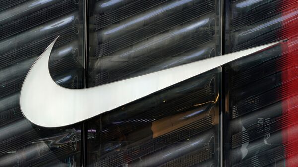 FILE PHOTO: The Nike swoosh logo is seen outside the store on 5th Ave in New York, New York, U.S., March 19, 2019.   - Sputnik International